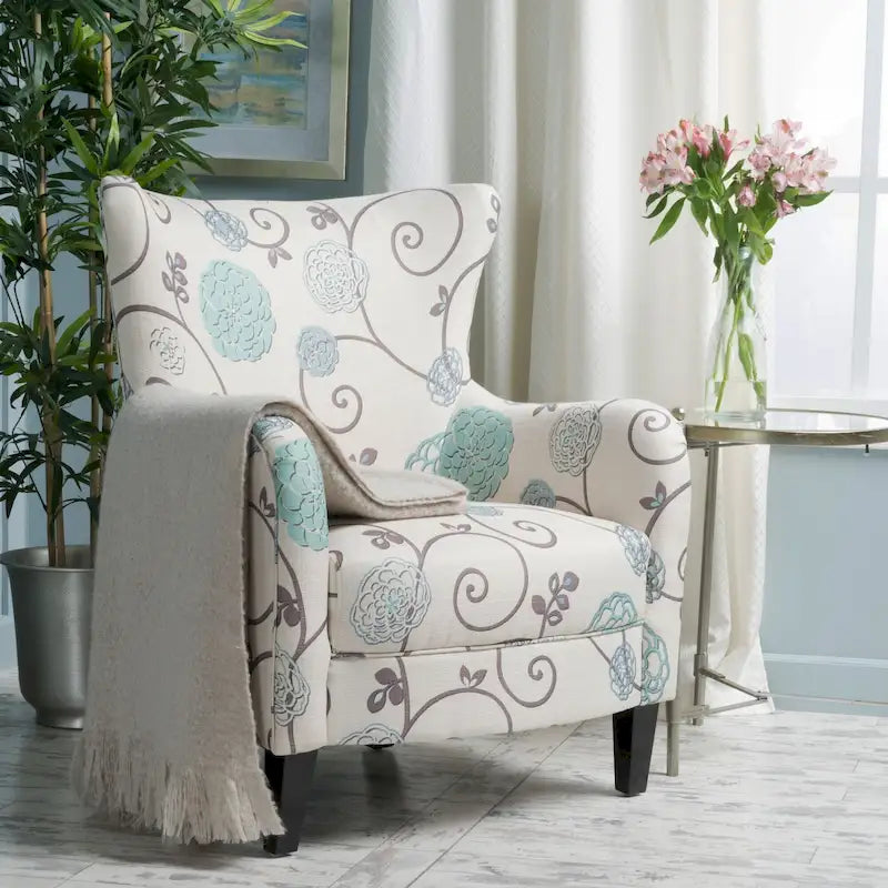 Sillón tapizado retro con estampado y respaldo alto, con patas de madera