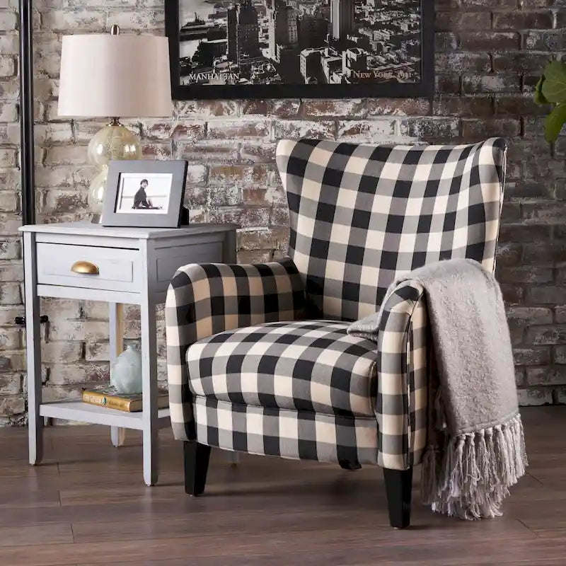 Sillón tapizado retro con estampado y respaldo alto, con patas de madera