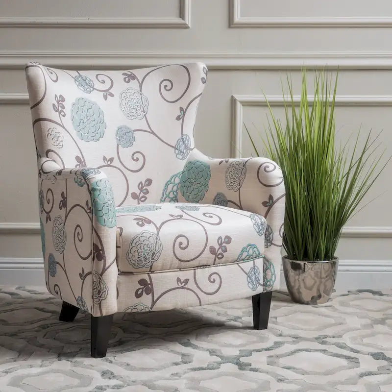 Sillón tapizado retro con estampado y respaldo alto, con patas de madera