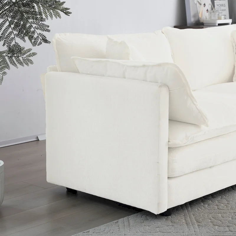 Sillón de chenilla blanco con asiento profundo y cojín decorativo