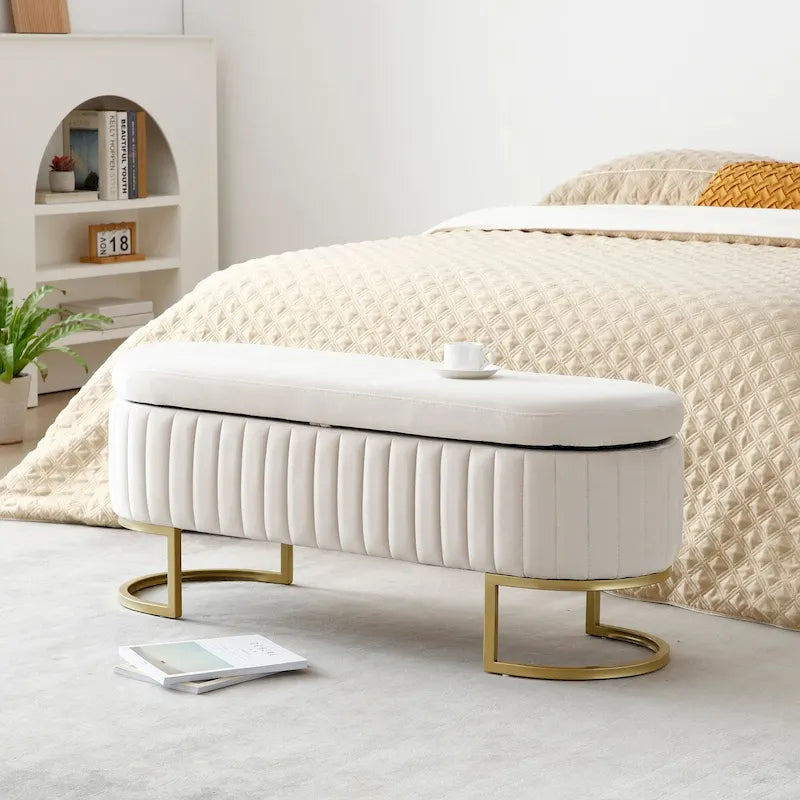 Banco de almacenamiento tapizado ovalado con tapa elevable y patas de metal dorado